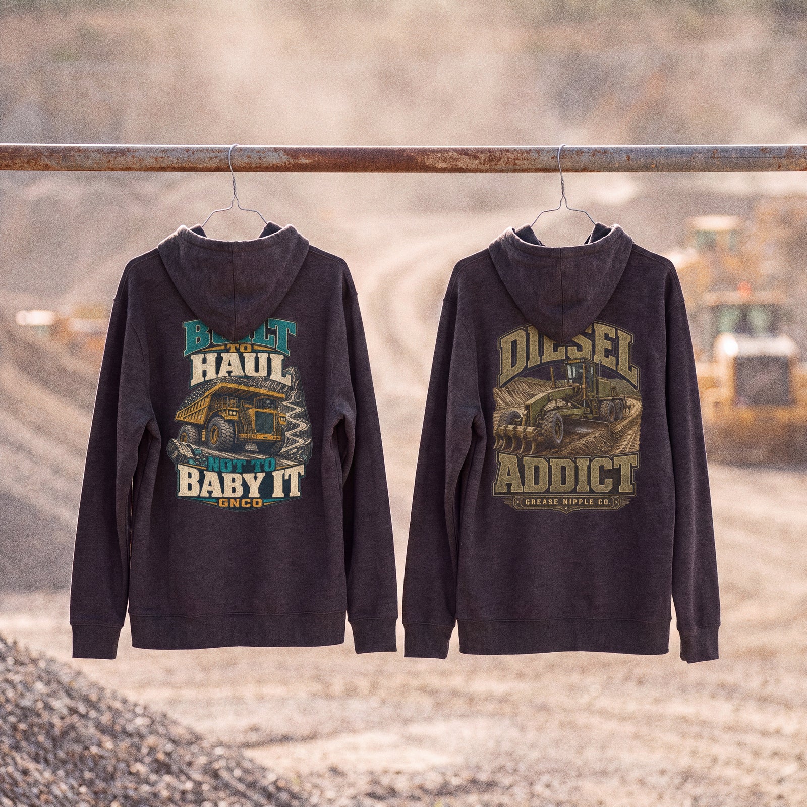 Two GNCO hoodies hanging from a scaffold pipe at a quarry