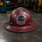 BLUE COLLAR COWGIRL 3-inch vinyl sticker on a worn maroon full-brim hard hat