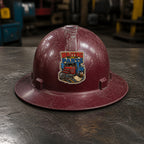 WAITING ON PARTS 3-inch vinyl sticker on a worn maroon full-brim hard hat